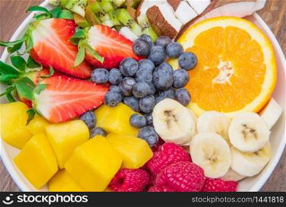 bowl of fresh and colored fruit salad