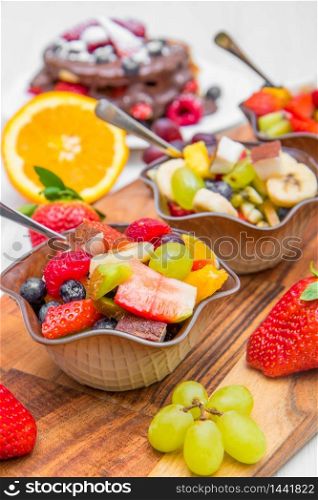 bowl of fresh and colored fruit salad
