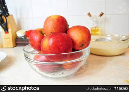 Bowl of fresh red apples on the kitchen counter