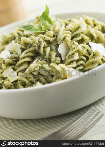 Bowl of Fusilli Pasta dressed in Pesto with Parmesan Shaves