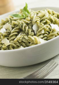 Bowl of Fusilli Pasta dressed in Pesto with Parmesan Shaves