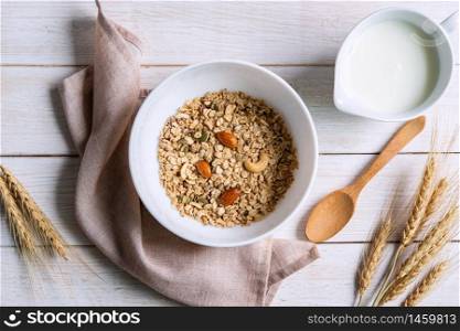 Bowl of granola almond and grains on white wooden table, Healthy breakfast