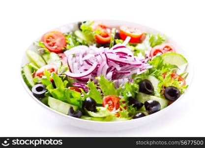 bowl of greek salad on white background