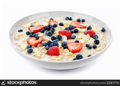 Bowl of hot oatmeal breakfast cereal with fresh berries