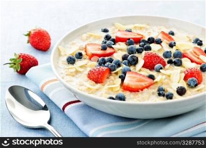 Bowl of hot oatmeal breakfast cereal with fresh berries