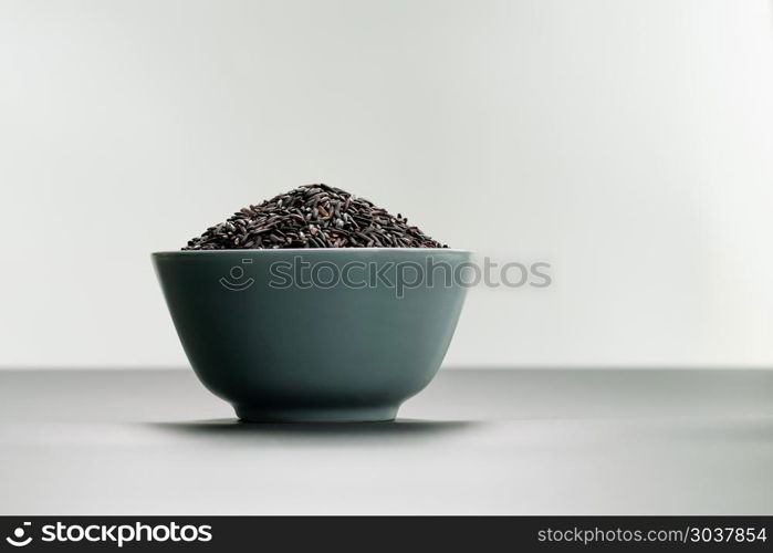bowl of jasmine black rice on white backgrounds