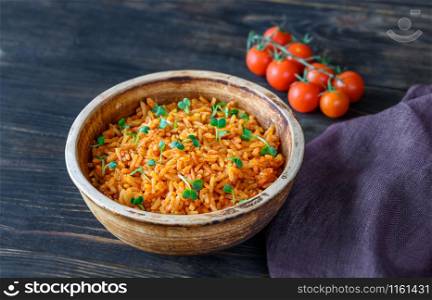Bowl of Mexican rice on the wooden table