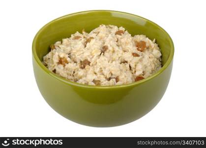 Bowl of oatmeal cereal with raisins isolated on white background