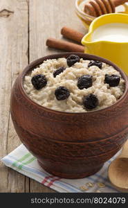 bowl of oatmeal on wood background