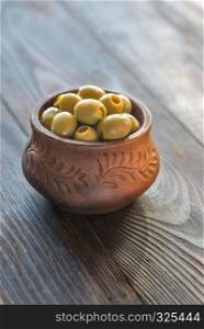Bowl of olives on the wooden table