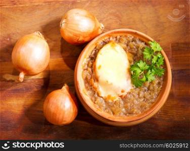bowl of onion soup on wooden table