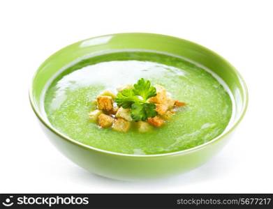 bowl of pea soup on white background