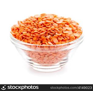Bowl of red lentils isolated on white background