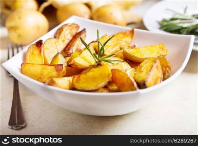 bowl of roasted potatoes with rosemary