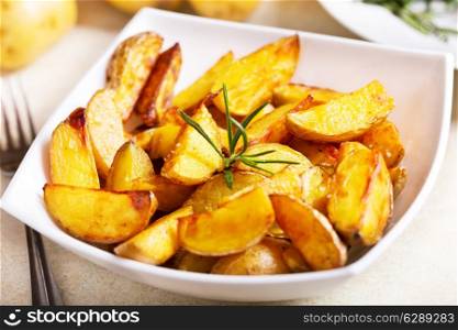 bowl of roasted potatoes with rosemary