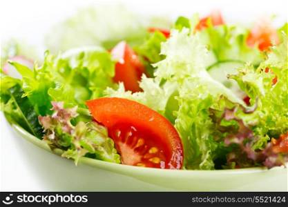 bowl of salad with vegetables and greens