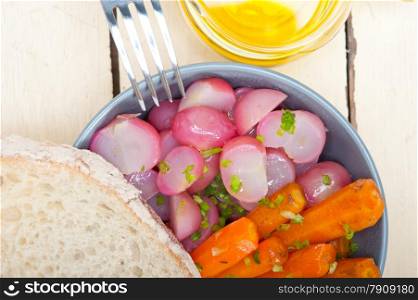 bowl of steamed root vegetable on a rustic white wood table