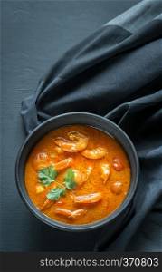 Bowl of thai yellow curry with seafood