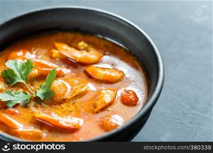 Bowl of thai yellow curry with seafood
