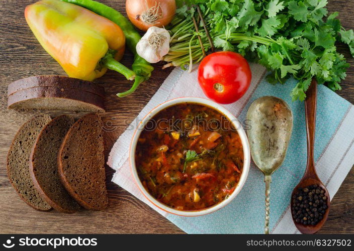 Bowl of traditional soup Borscht on table