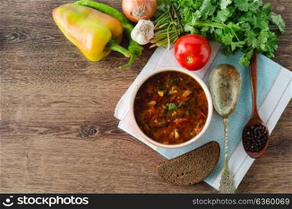 Bowl of traditional soup Borscht on table