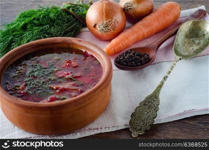 Bowl of traditional soup Borscht on table