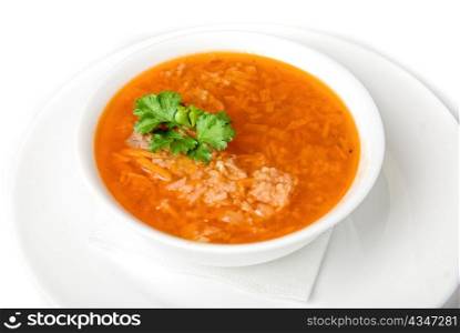 Bowl of vegetable borscht soup isolated on white