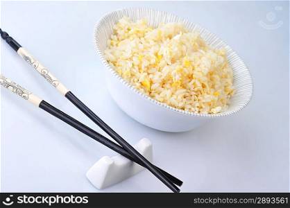 bowl of vegetable fried rice and chopstick. chinese cuisine
