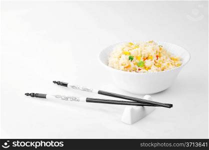 bowl of vegetable fried rice and chopstick. chinese cuisine