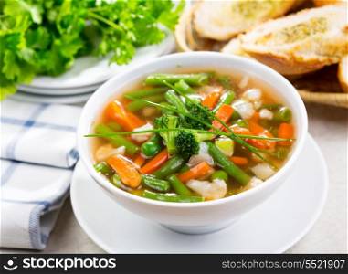 bowl of vegetable soup with parsley