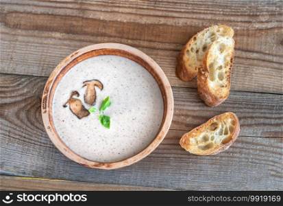 Bowl of wild mushroom cream soup flat lay
