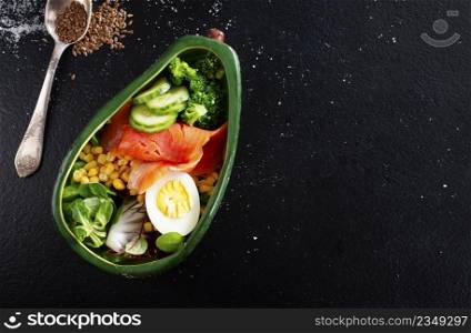 bowl with avocado, salmon, couscous and poached egg
