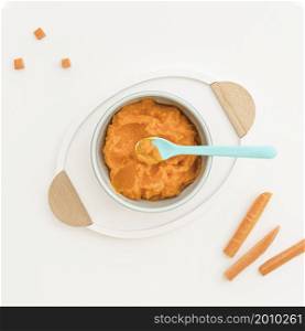 bowl with carrot baby puree