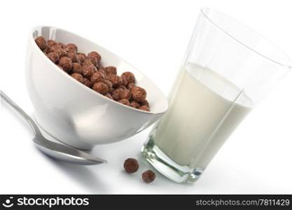bowl with chocolate balls and glass of milk isolated