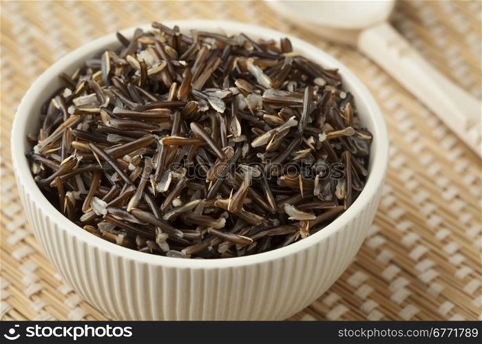 Bowl with cooked black wild rice