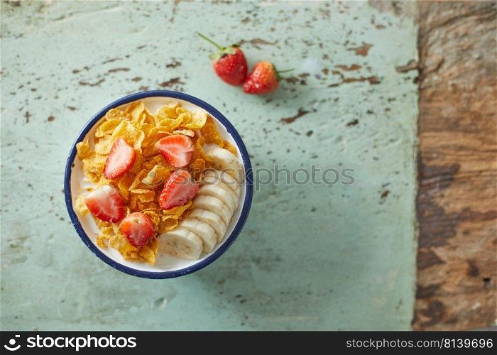 Bowl with cornflakes on background. 