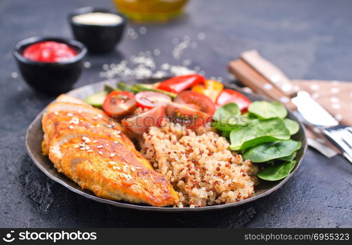 Bowl with healthy salad. Buddha bowl with quinoa seeds avocado red bell pepper fresh spinach mix