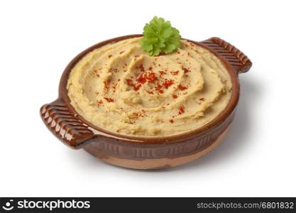 Bowl with hummus and chili pepper on white background