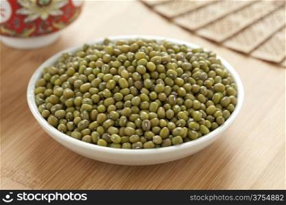 Bowl with Mung beans on the table