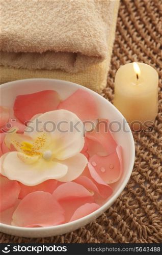 Bowl with orchid and rose petals