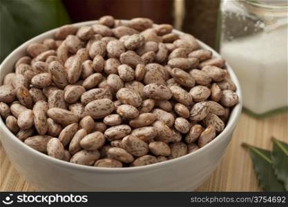Bowl with pinto beans on the table