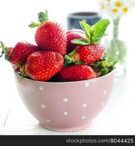 Bowl with strawberry, still life backlight photography