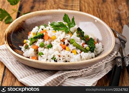 Bowl with tasty rice and vegetables. Selective focus.. Bowl with tasty rice and vegetables