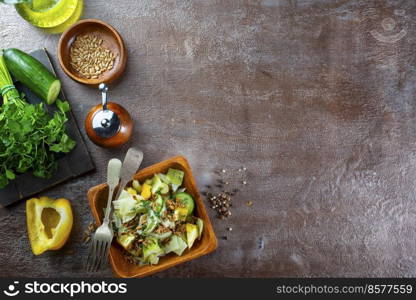 Bowl with tasty vegetable salad on stone table