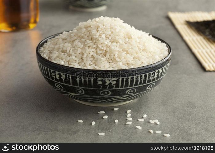 Bowl with uncooked Japanese sushi rice