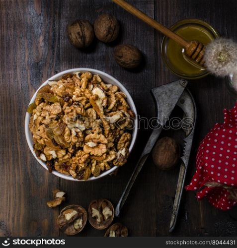 Bowl with walnut, still life dark photo