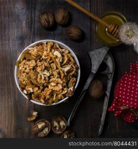 Bowl with walnut, still life dark photo