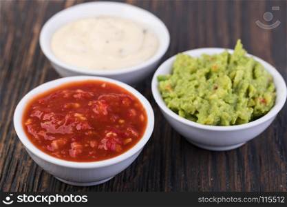 Bowls with sauces . Bowls with sauces on white background