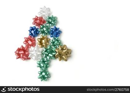 bows on white background making the shape of a christmas tree