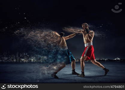 Box fighters trainning outdoor. Two strong fighters outdoor demonstrating ultimate fighting